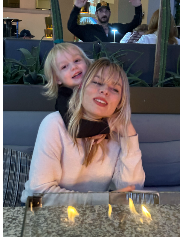 Blair Adrian Harring with child at restaurant